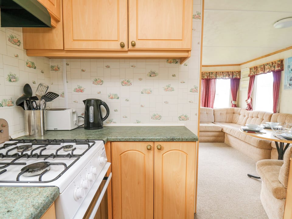 Fridge, electric kettle, toaster, cookware/dishes/utensils
