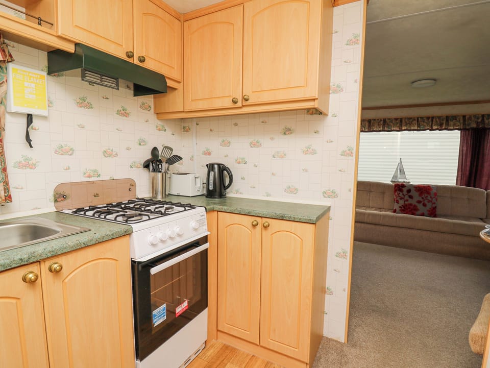 Fridge, electric kettle, toaster, cookware/dishes/utensils