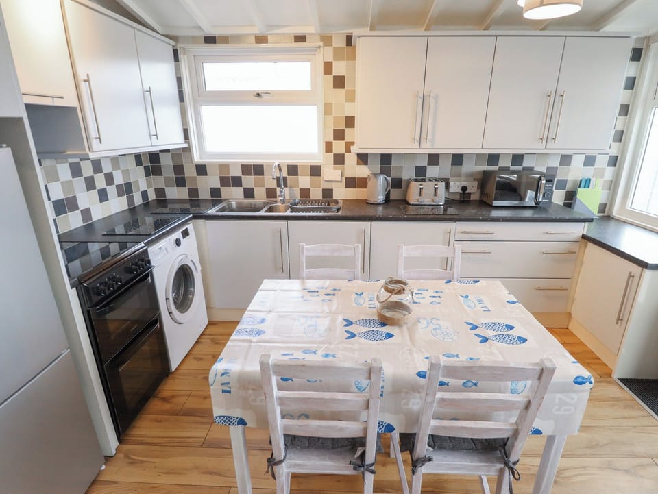 Fridge, electric kettle, toaster, cookware/dishes/utensils