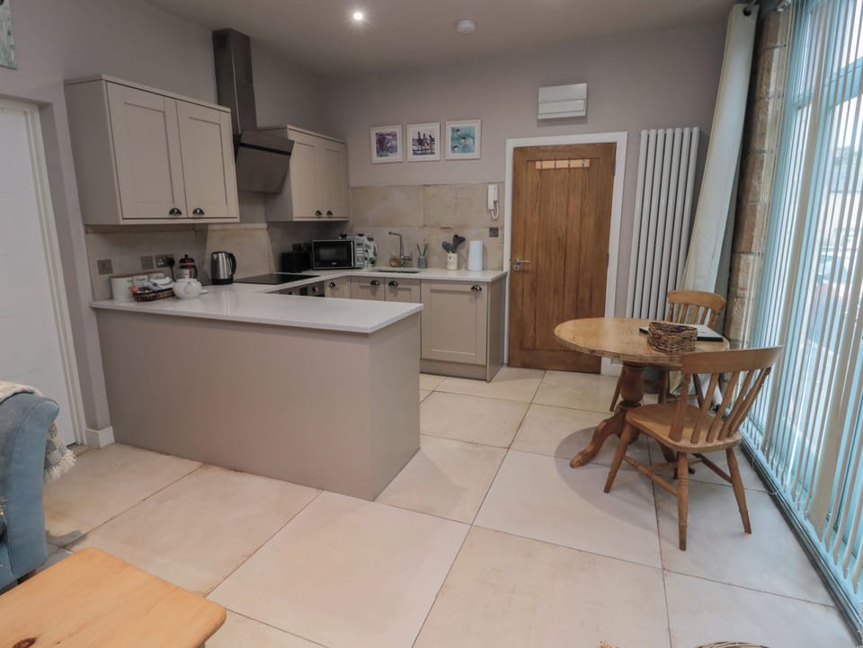 Fridge, electric kettle, cookware/dishes/utensils