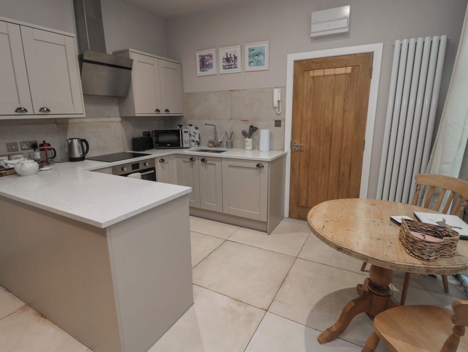 Fridge, electric kettle, cookware/dishes/utensils