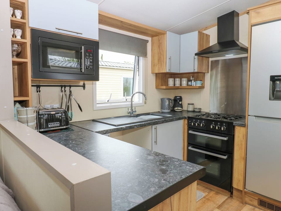 Fridge, electric kettle, cookware/dishes/utensils