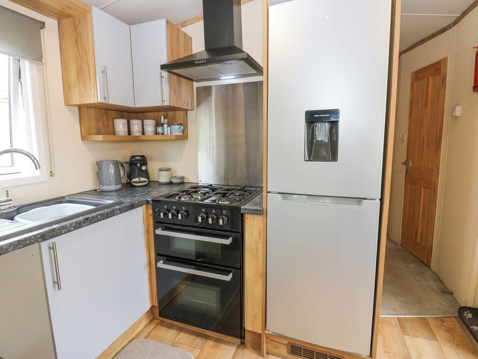 Fridge, electric kettle, cookware/dishes/utensils