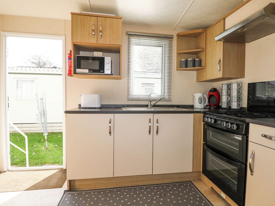 Fridge, electric kettle, toaster, cookware/dishes/utensils