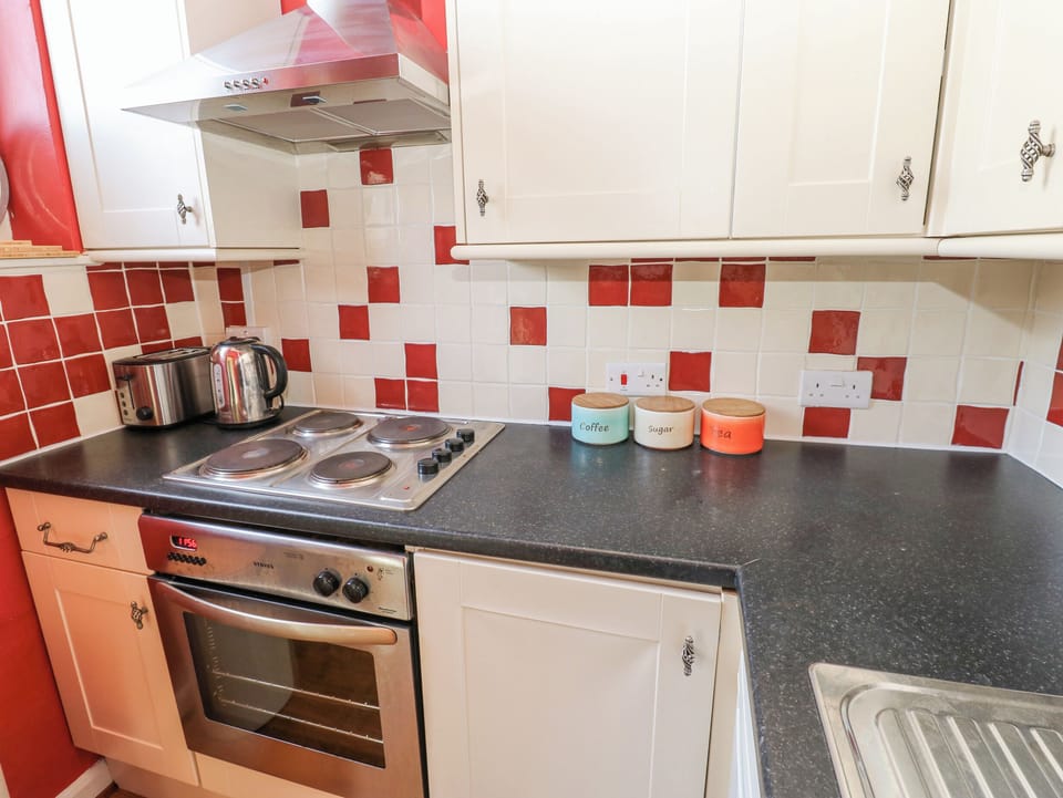 Fridge, electric kettle, toaster, cookware/dishes/utensils