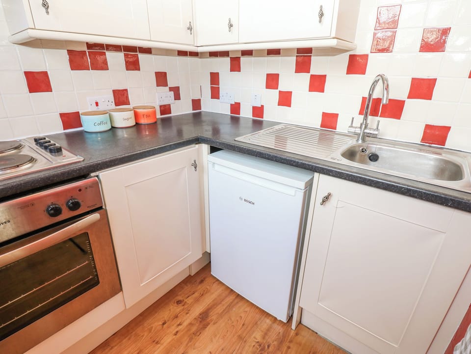 Fridge, electric kettle, toaster, cookware/dishes/utensils