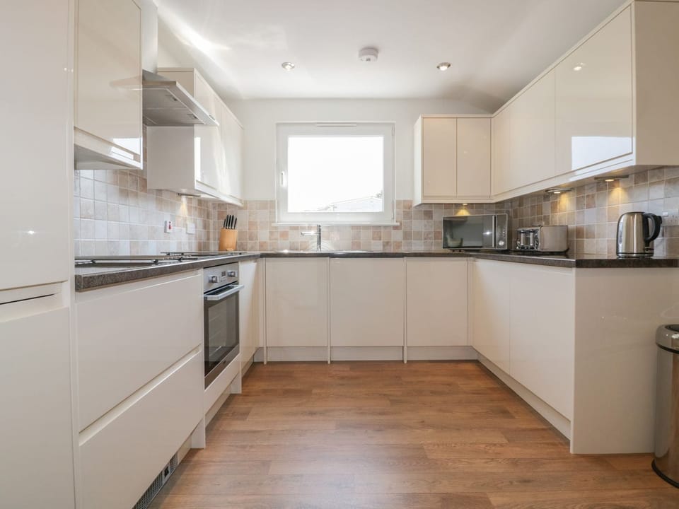 Fridge, dishwasher, electric kettle, cookware/dishes/utensils