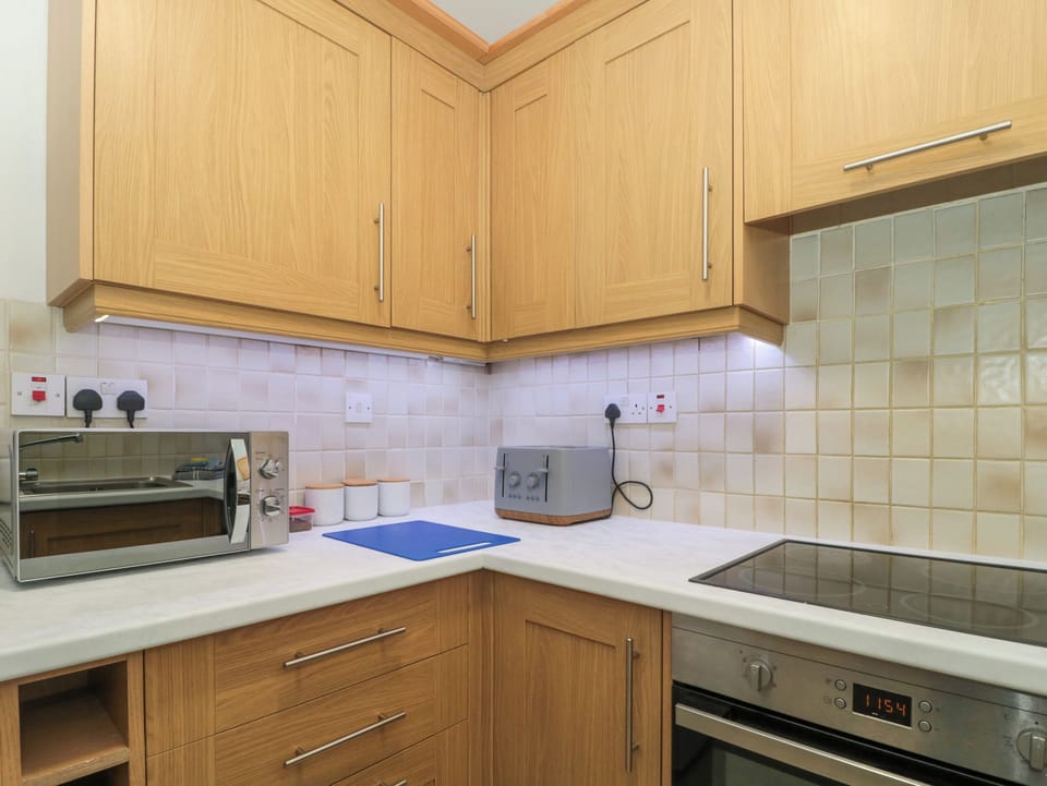 Fridge, electric kettle, toaster, cookware/dishes/utensils