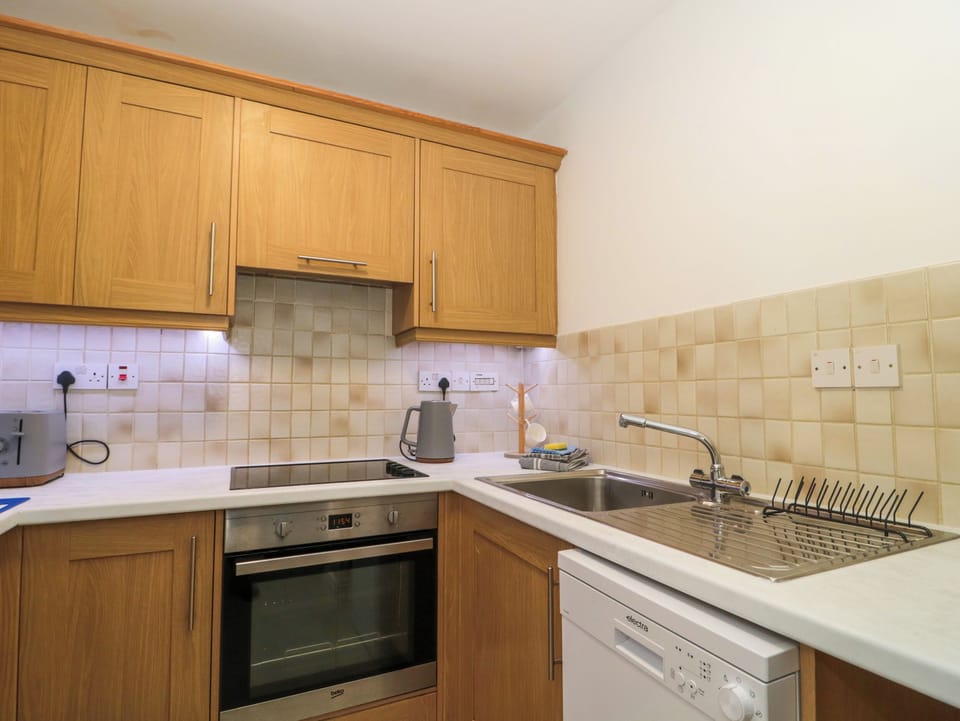 Fridge, electric kettle, toaster, cookware/dishes/utensils