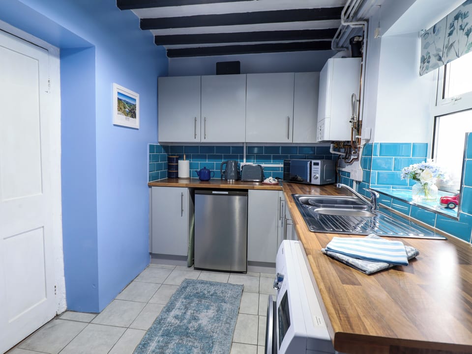 Fridge, electric kettle, toaster, cookware/dishes/utensils