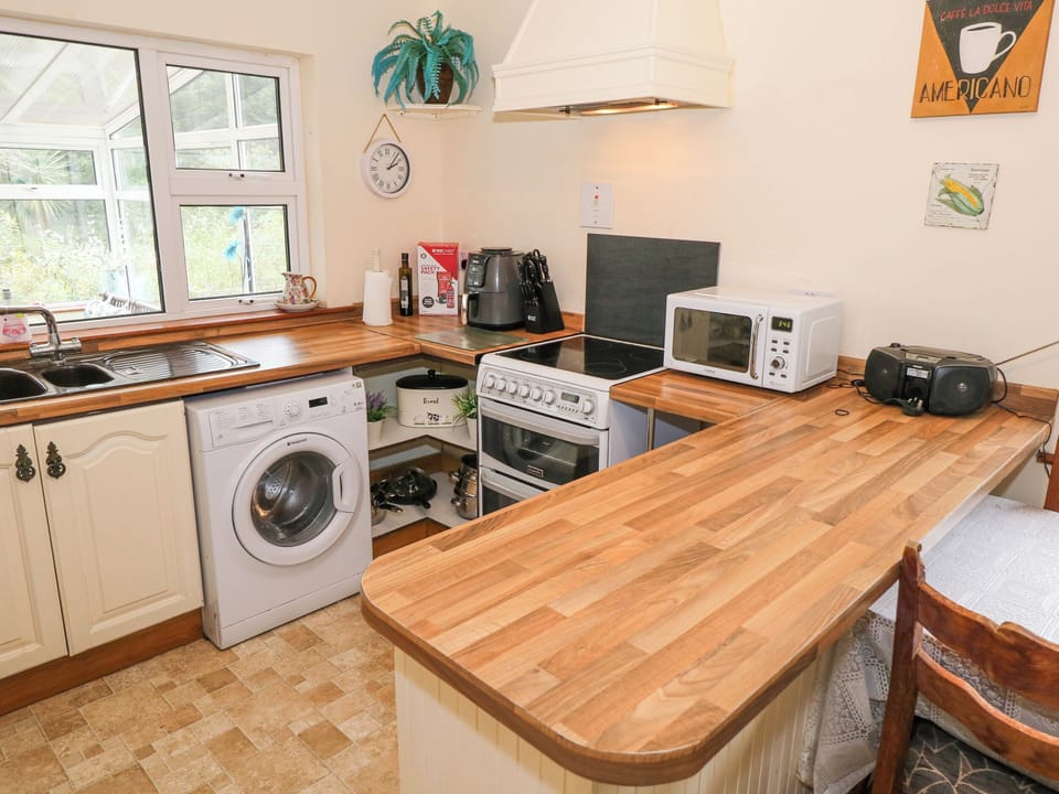 Fridge, electric kettle, toaster, cookware/dishes/utensils