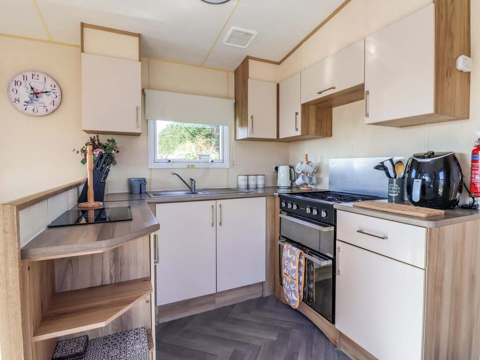 Fridge, electric kettle, toaster, cookware/dishes/utensils