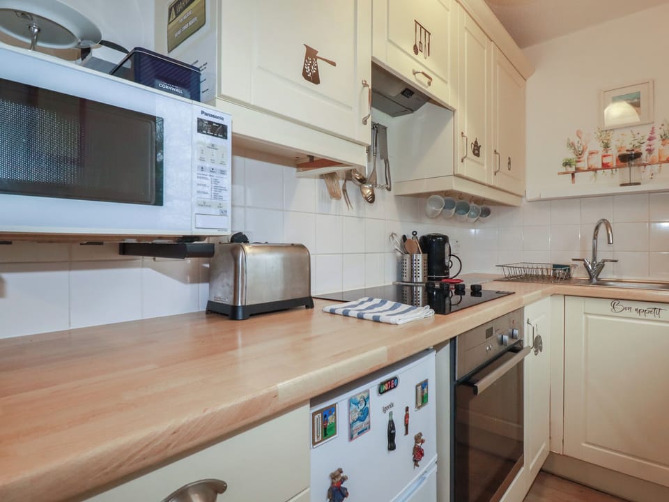 Fridge, electric kettle, toaster, cookware/dishes/utensils