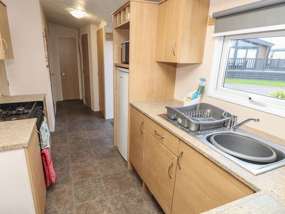 Fridge, electric kettle, cookware/dishes/utensils