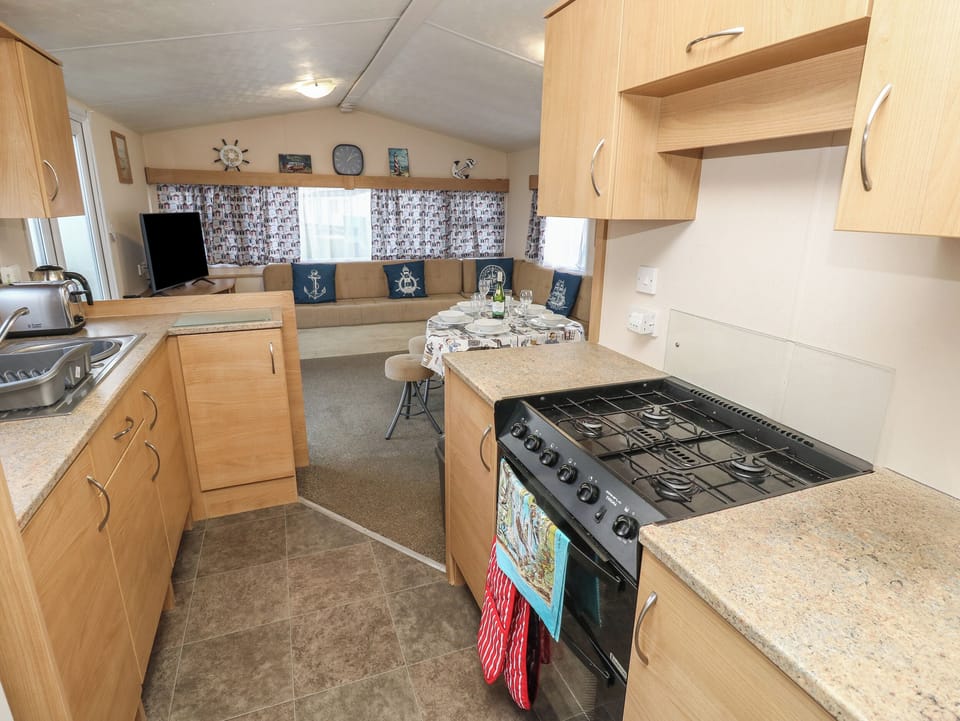 Fridge, electric kettle, cookware/dishes/utensils