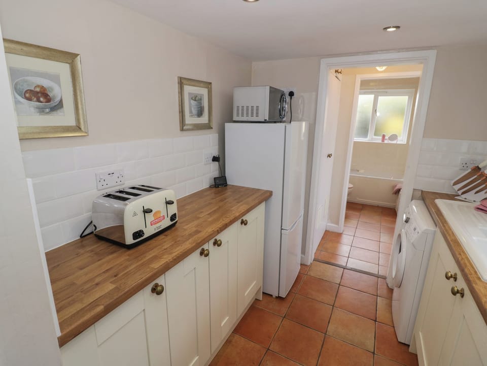 Fridge, electric kettle, toaster, cookware/dishes/utensils