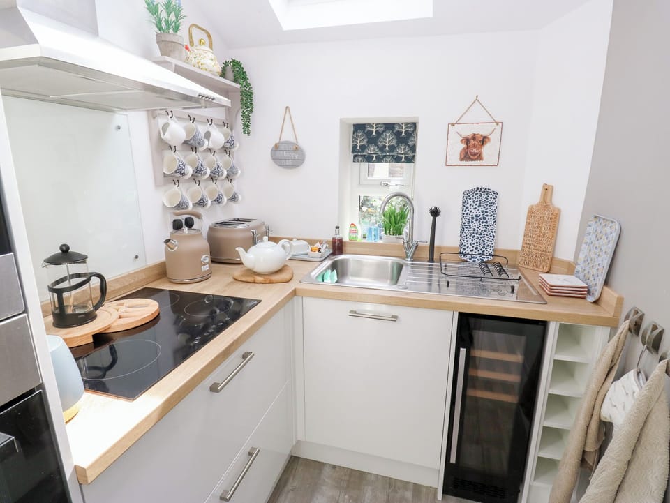 Fridge, electric kettle, toaster, cookware/dishes/utensils
