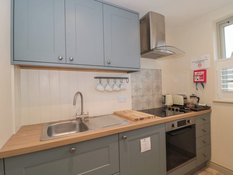 Fridge, electric kettle, toaster, cookware/dishes/utensils