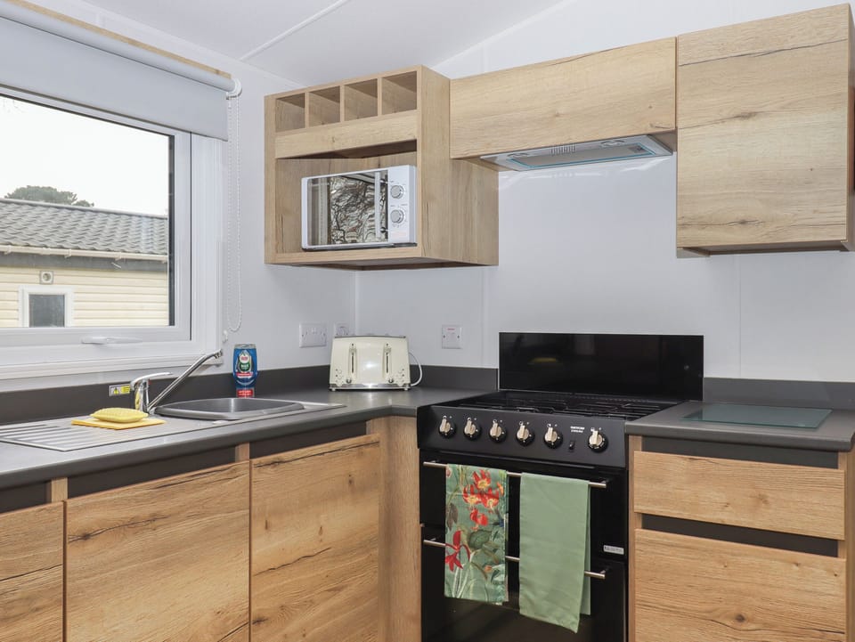 Fridge, electric kettle, toaster, cookware/dishes/utensils