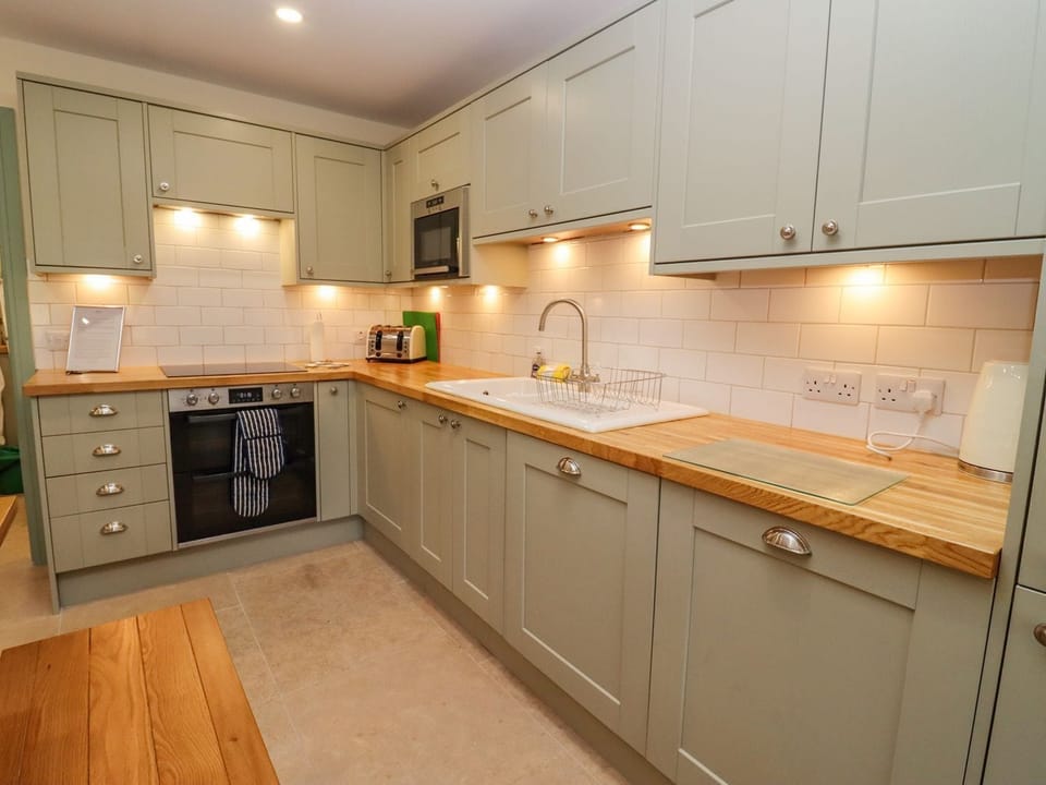 Fridge, electric kettle, cookware/dishes/utensils