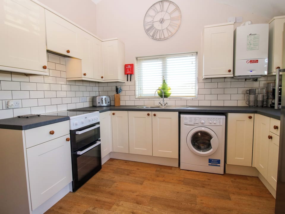 Fridge, electric kettle, toaster, cookware/dishes/utensils