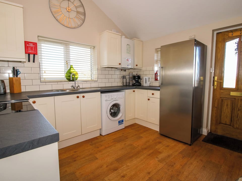 Fridge, electric kettle, toaster, cookware/dishes/utensils