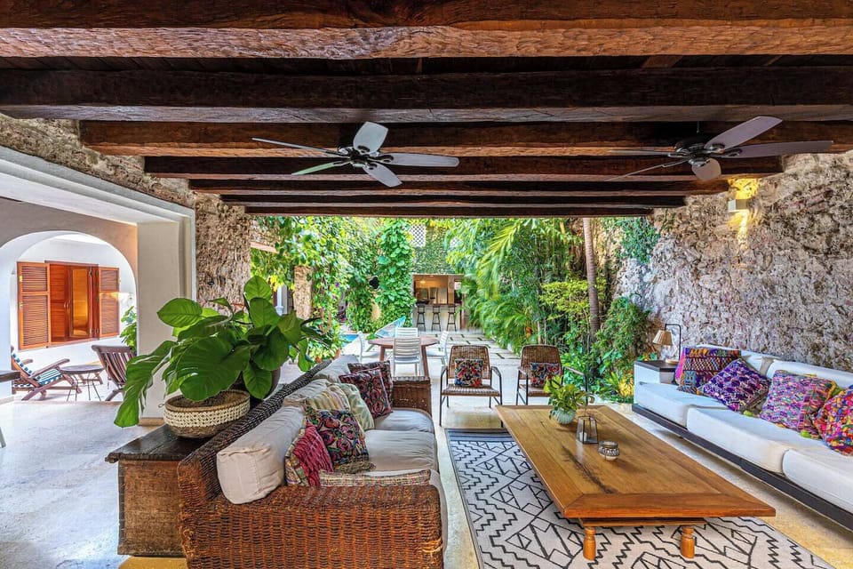 Outdoor living · Century-old wooden beams · Lush garden