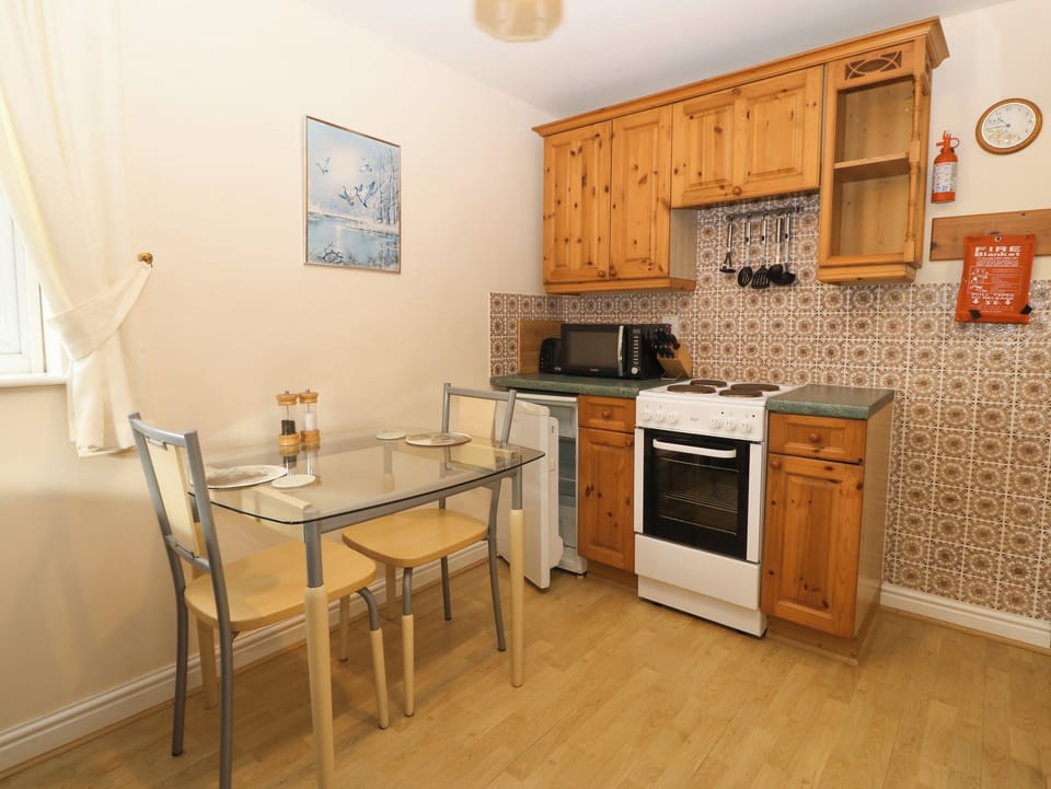 Fridge, electric kettle, toaster, cookware/dishes/utensils
