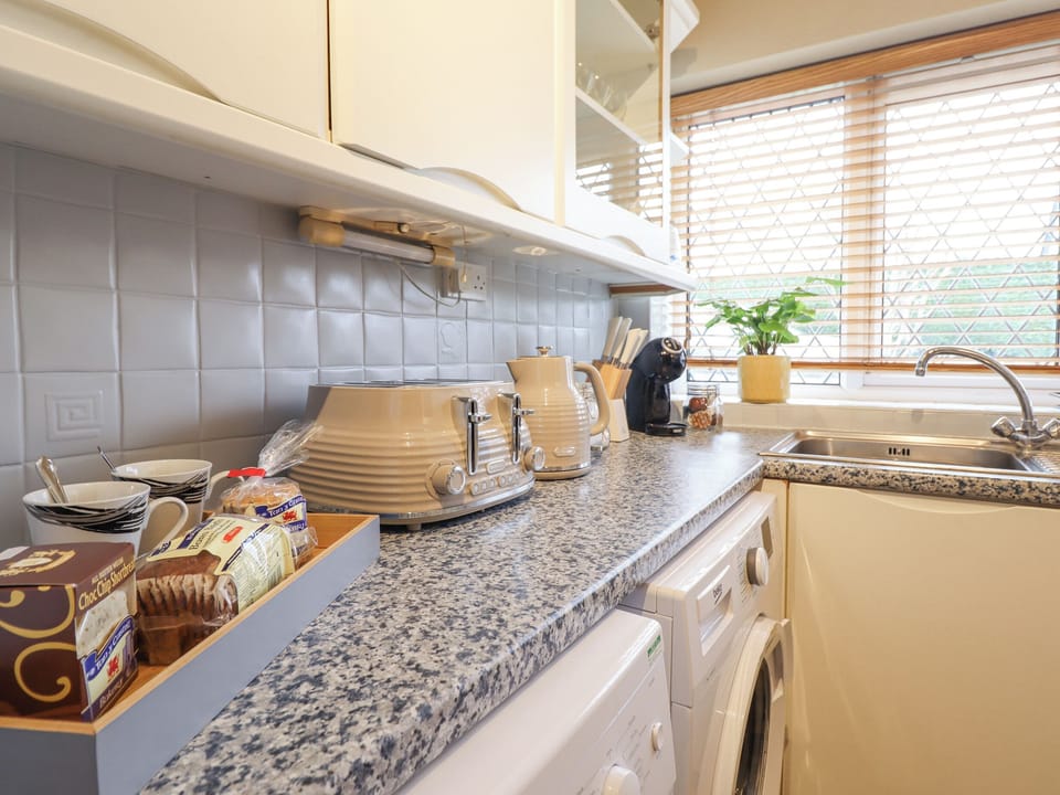 Fridge, electric kettle, cookware/dishes/utensils