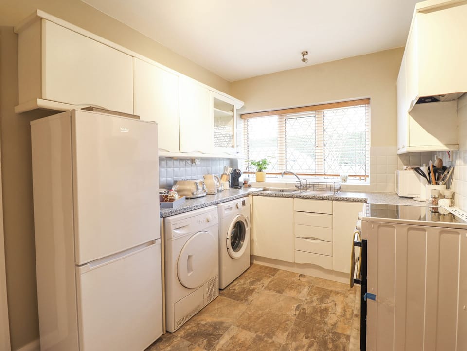 Fridge, electric kettle, cookware/dishes/utensils
