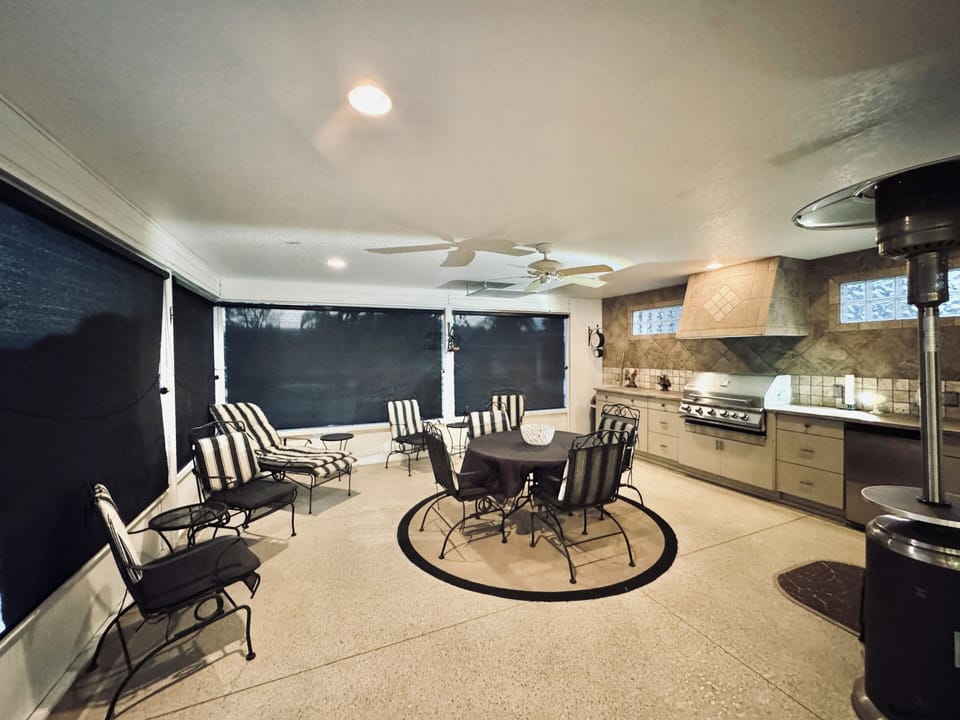 Screened-in Lanai Reflecting Privacy Shades with Flatscreen TV, Grill and Mini Fridge Overlooking the Stunning Golf Course!
