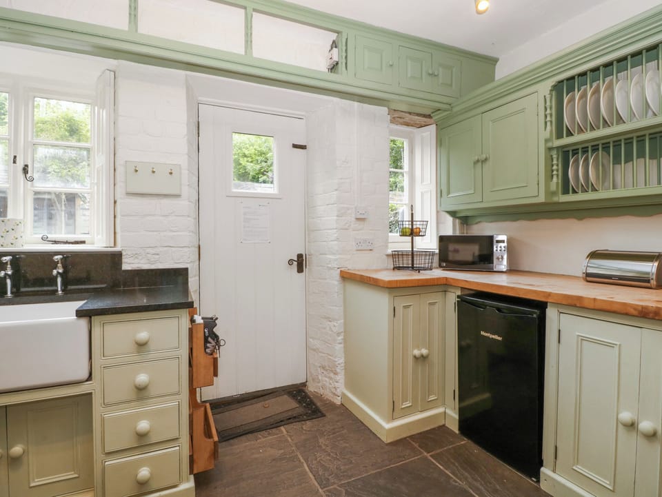 Fridge, electric kettle, toaster, cookware/dishes/utensils