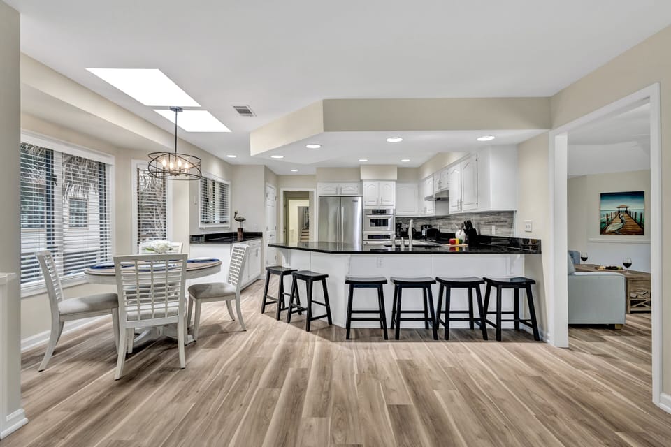 The spacious kitchen provides plenty of seating at the island and breakfast nook