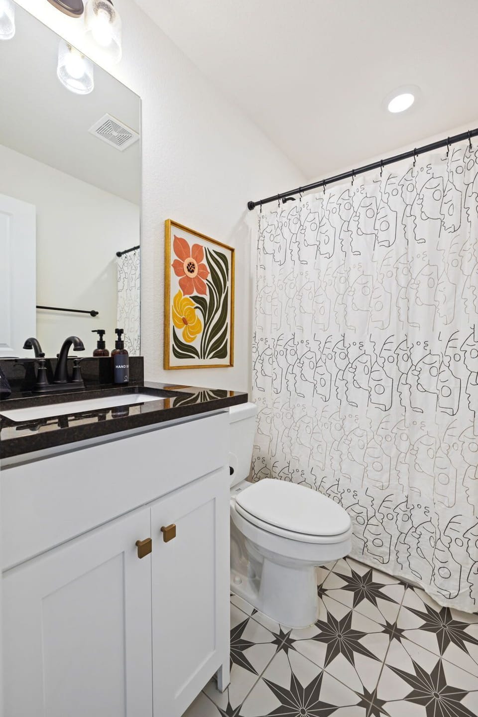 A full bathroom is located at the end of the hallway.