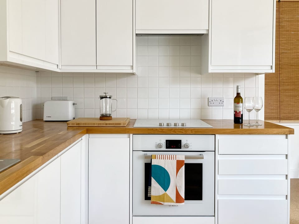 Fridge, electric kettle, toaster, cookware/dishes/utensils