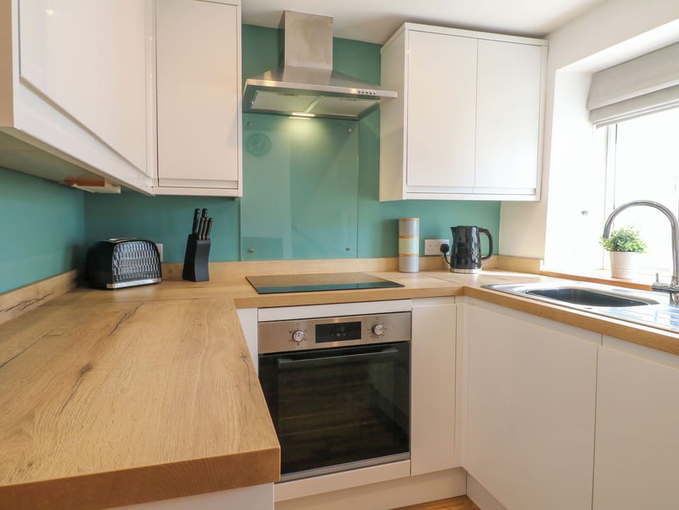 Fridge, electric kettle, toaster, cookware/dishes/utensils