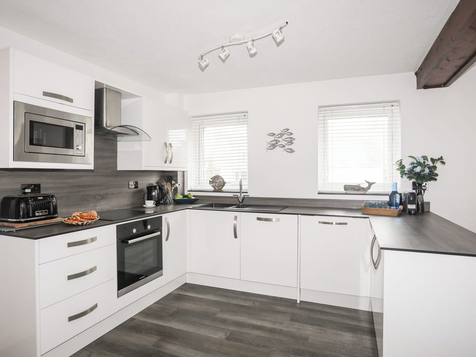 Fridge, dishwasher, electric kettle, cookware/dishes/utensils