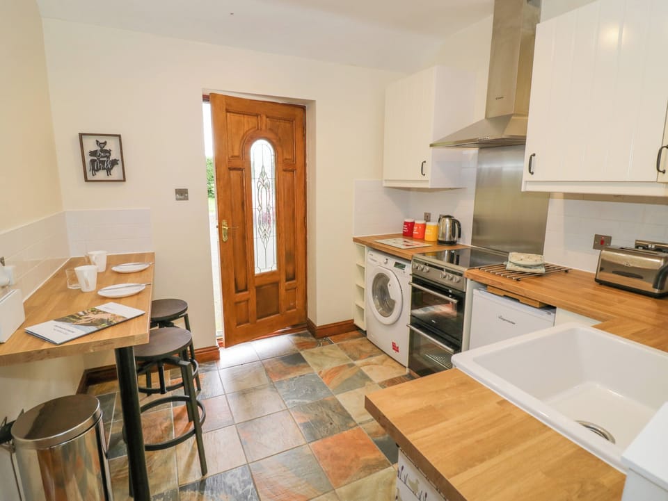 Fridge, electric kettle, toaster, cookware/dishes/utensils