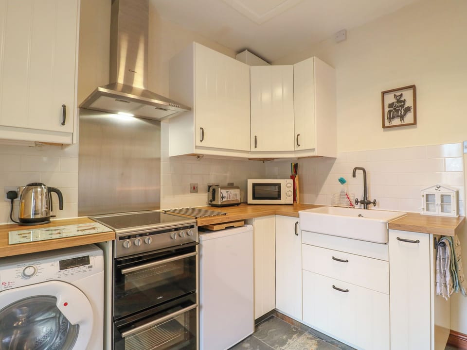 Fridge, electric kettle, toaster, cookware/dishes/utensils