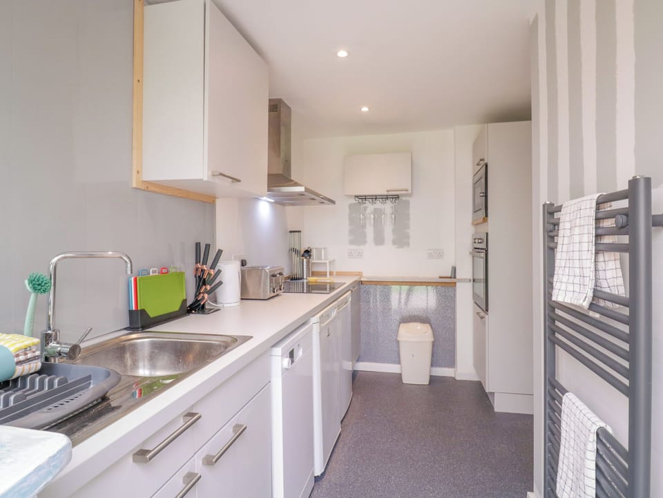 Fridge, dishwasher, electric kettle, cookware/dishes/utensils