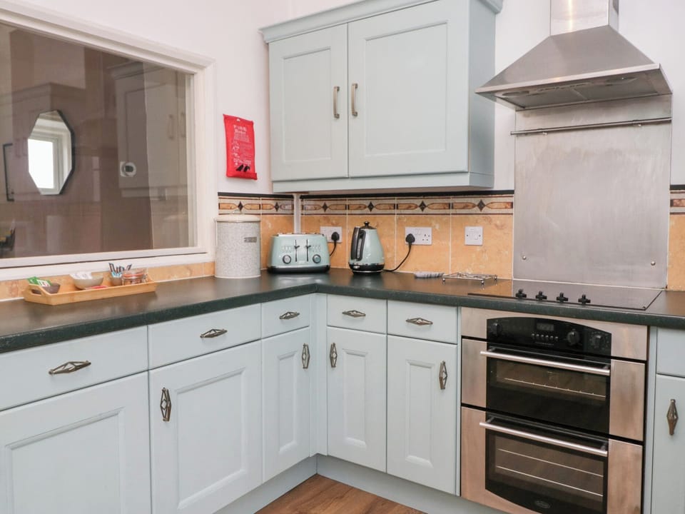 Fridge, electric kettle, toaster, cookware/dishes/utensils