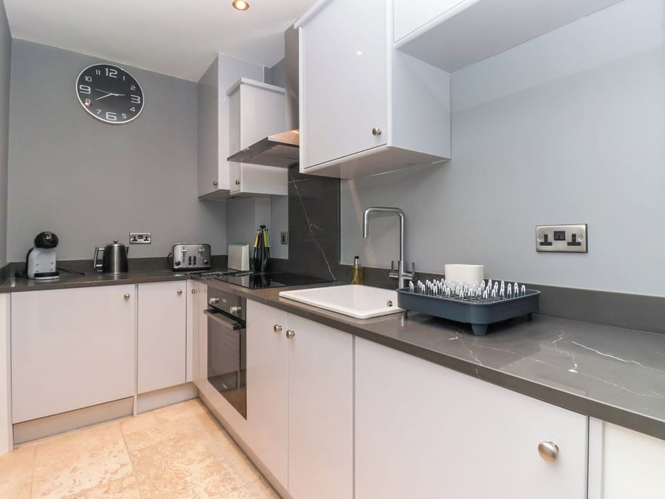 Fridge, electric kettle, toaster, cookware/dishes/utensils