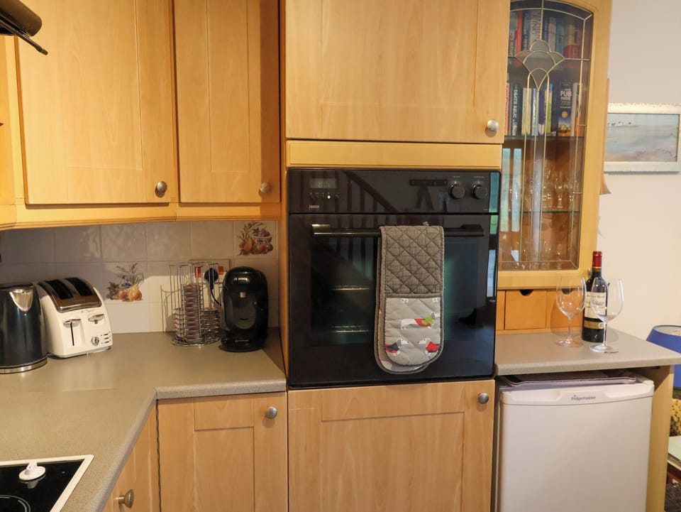 Fridge, electric kettle, toaster, cookware/dishes/utensils