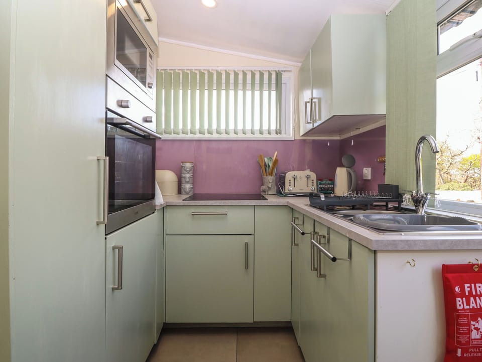 Fridge, electric kettle, toaster, cookware/dishes/utensils
