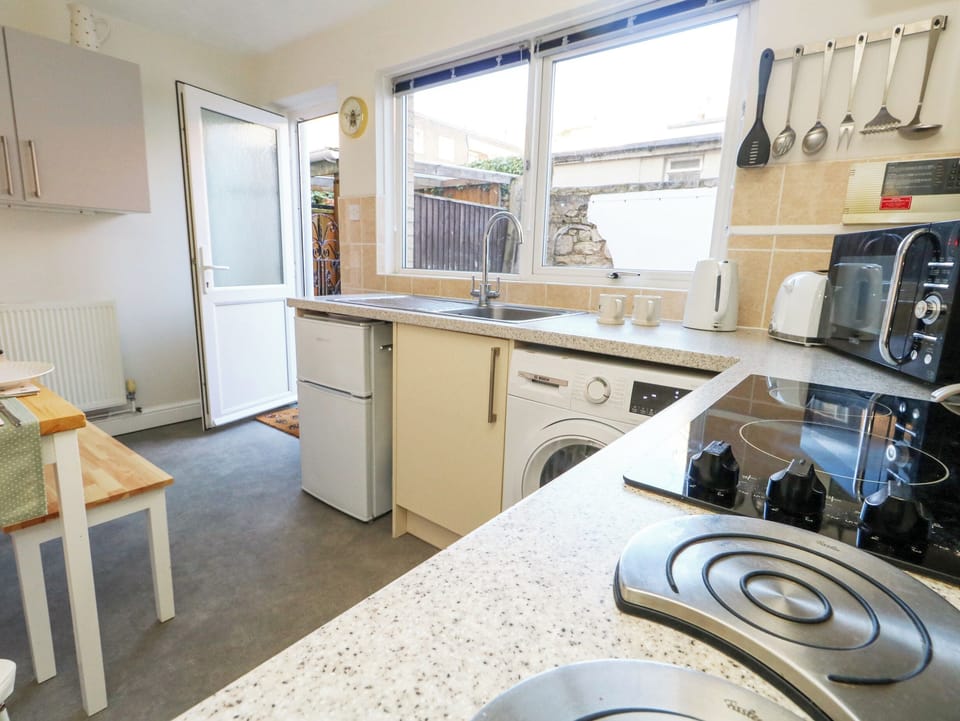 Fridge, electric kettle, toaster, cookware/dishes/utensils