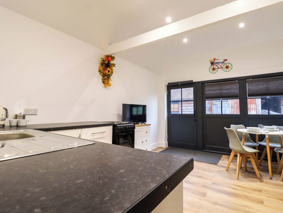 Fridge, electric kettle, cookware/dishes/utensils