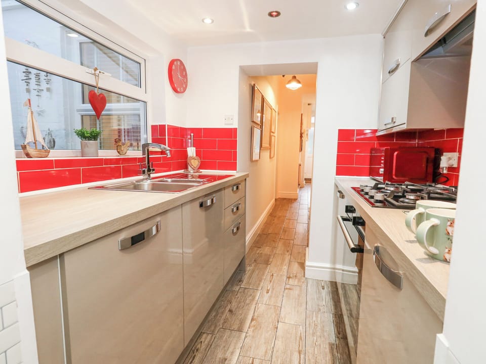 Fridge, electric kettle, cookware/dishes/utensils