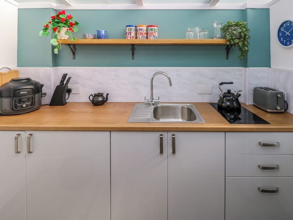 Fridge, electric kettle, toaster, cookware/dishes/utensils