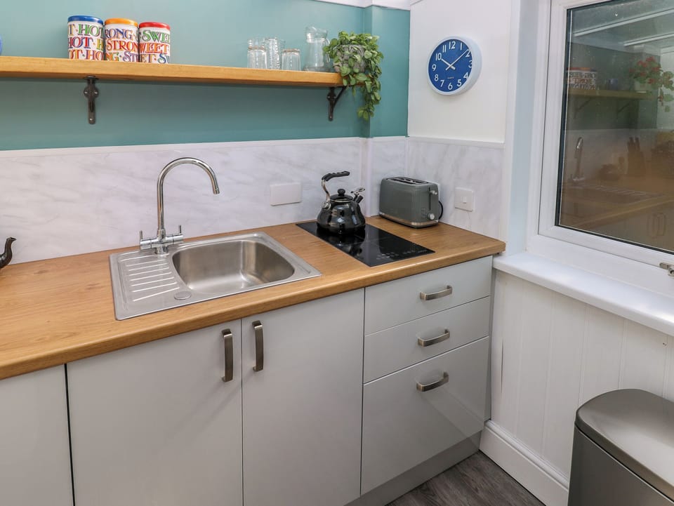 Fridge, electric kettle, toaster, cookware/dishes/utensils
