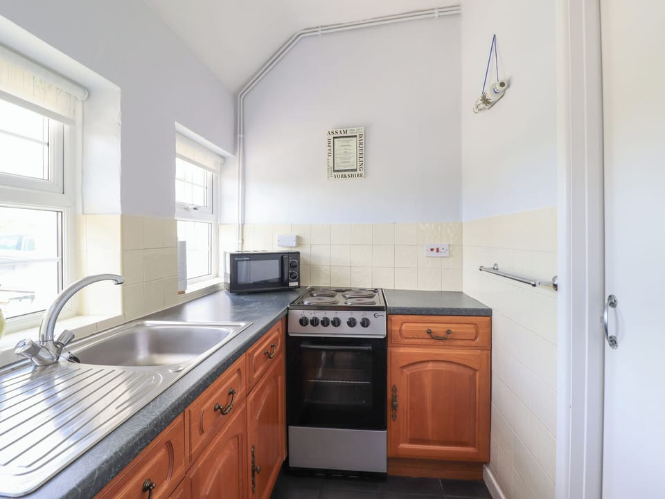 Fridge, electric kettle, toaster, cookware/dishes/utensils